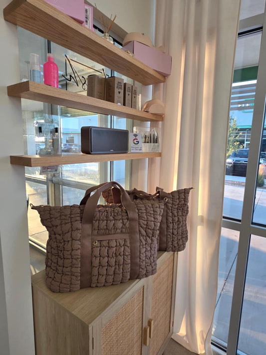 2 lash supply kits sitting on the salon counter